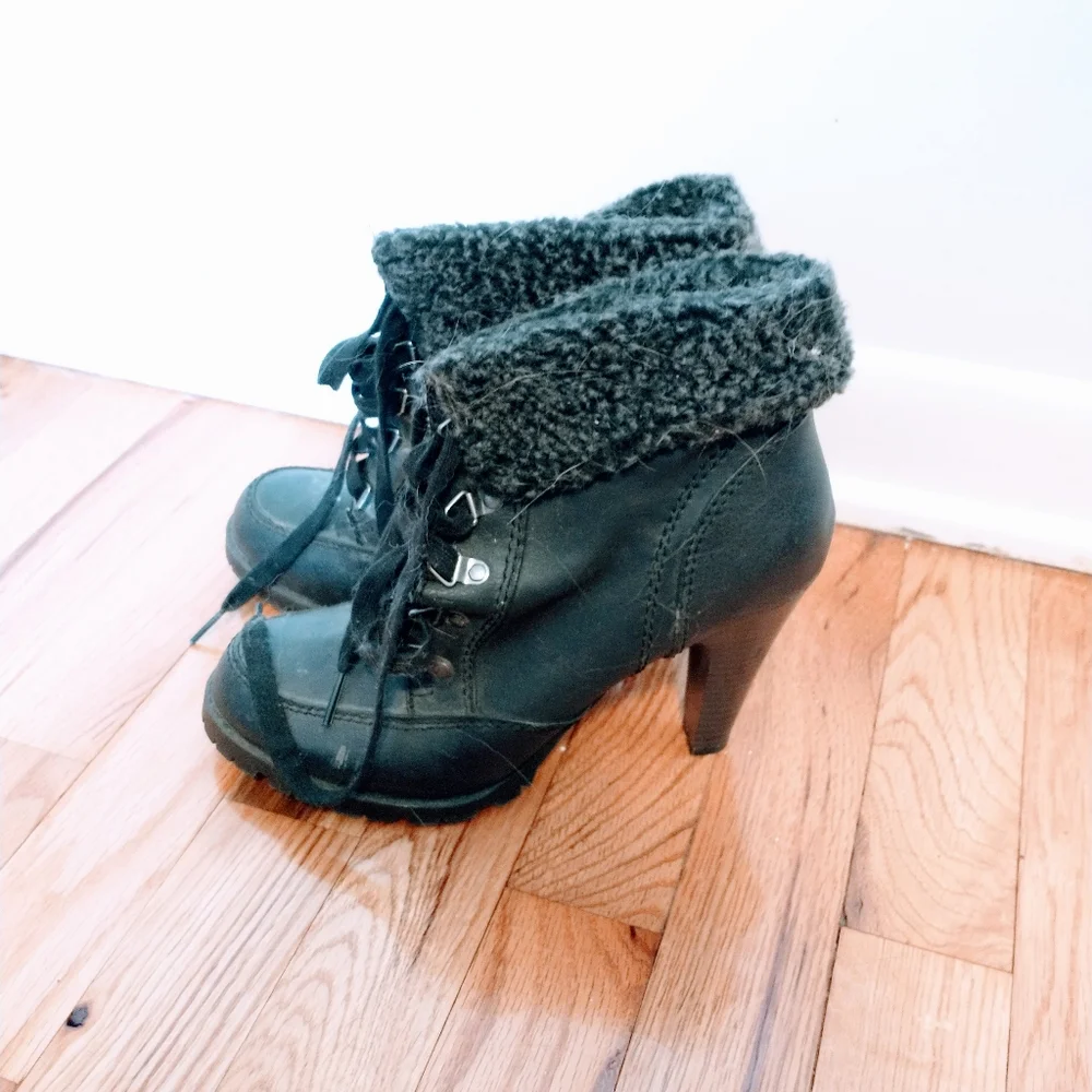 Ankle boots with heel and fur around the ankle.  Minor wear at the heel inside t